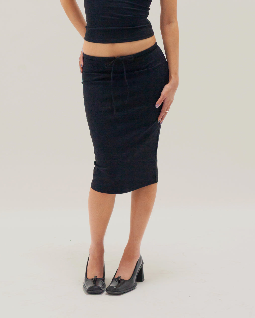 UNIFORM MIDI SKIRT